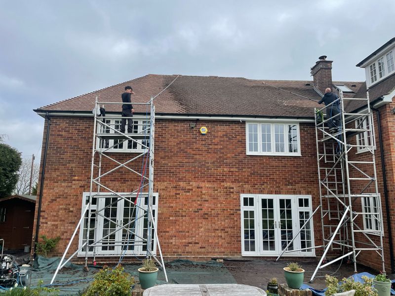 Roof cleaning carried out safely from scaffold towers by The Roof Moss Cleaners in Letchworth Garden City